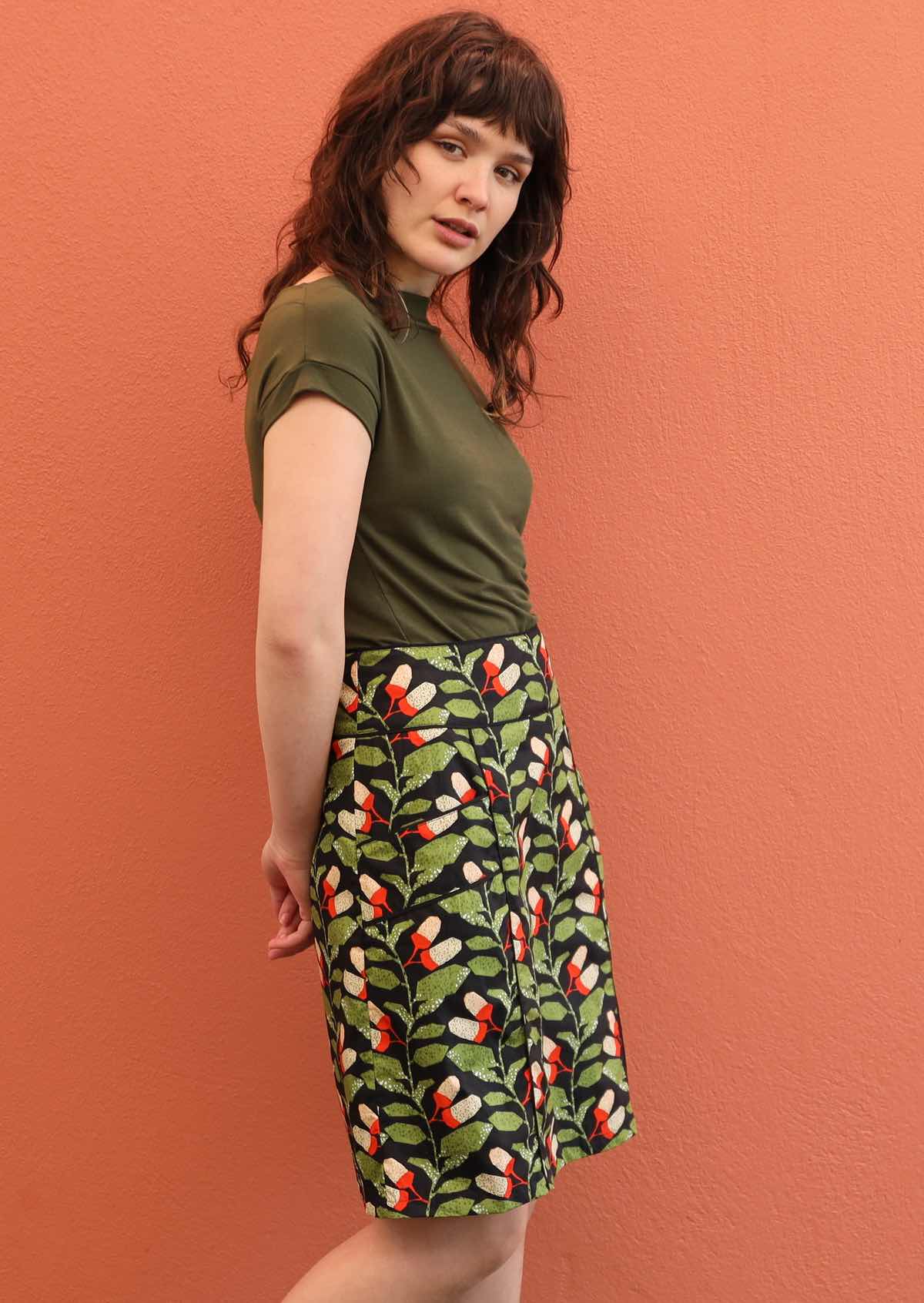 Model wears knee length cotton skirt with hidden side zip