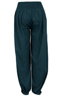 Back view of cotton relaxed fit pants in deep teal with buttoned ankles and elastic at back of the waist
