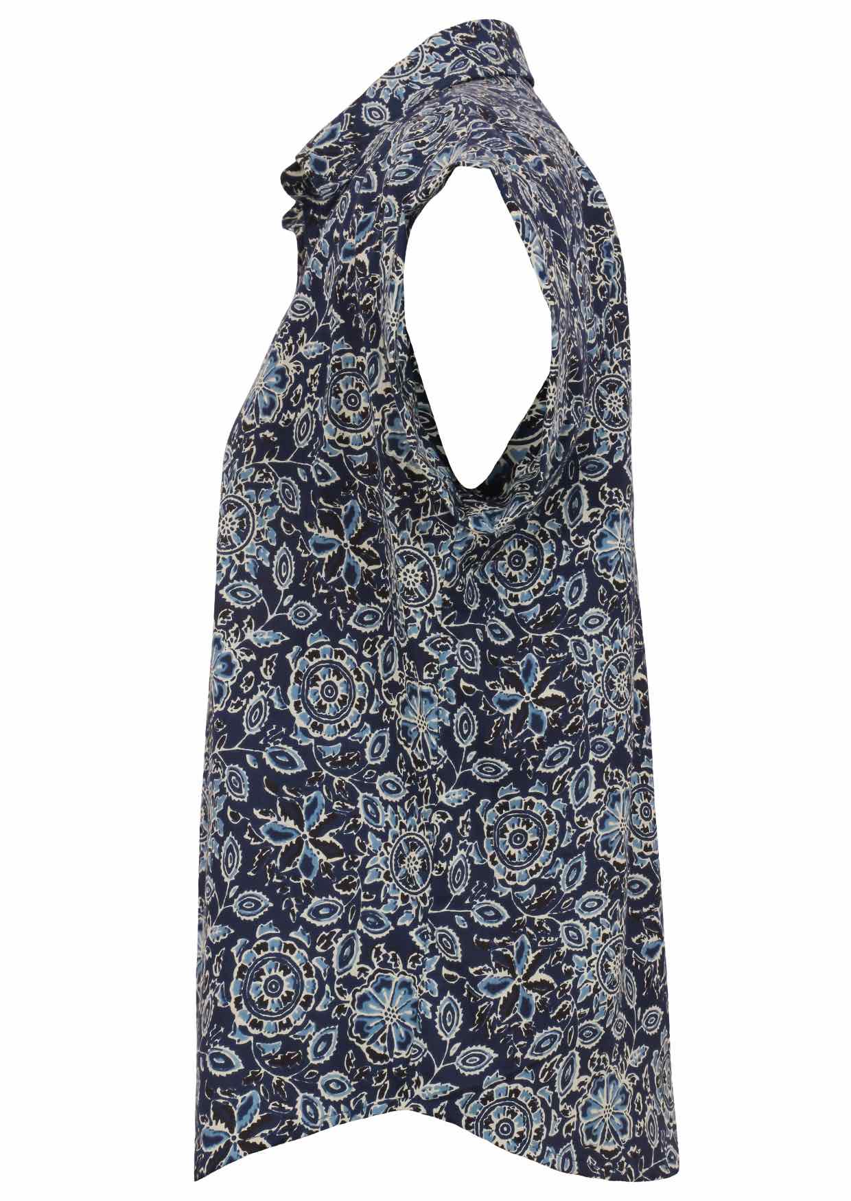 Side view of loose fit shirt style cotton top with collar in navy blue based floral print
