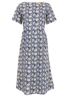 Mannequin front of dress.