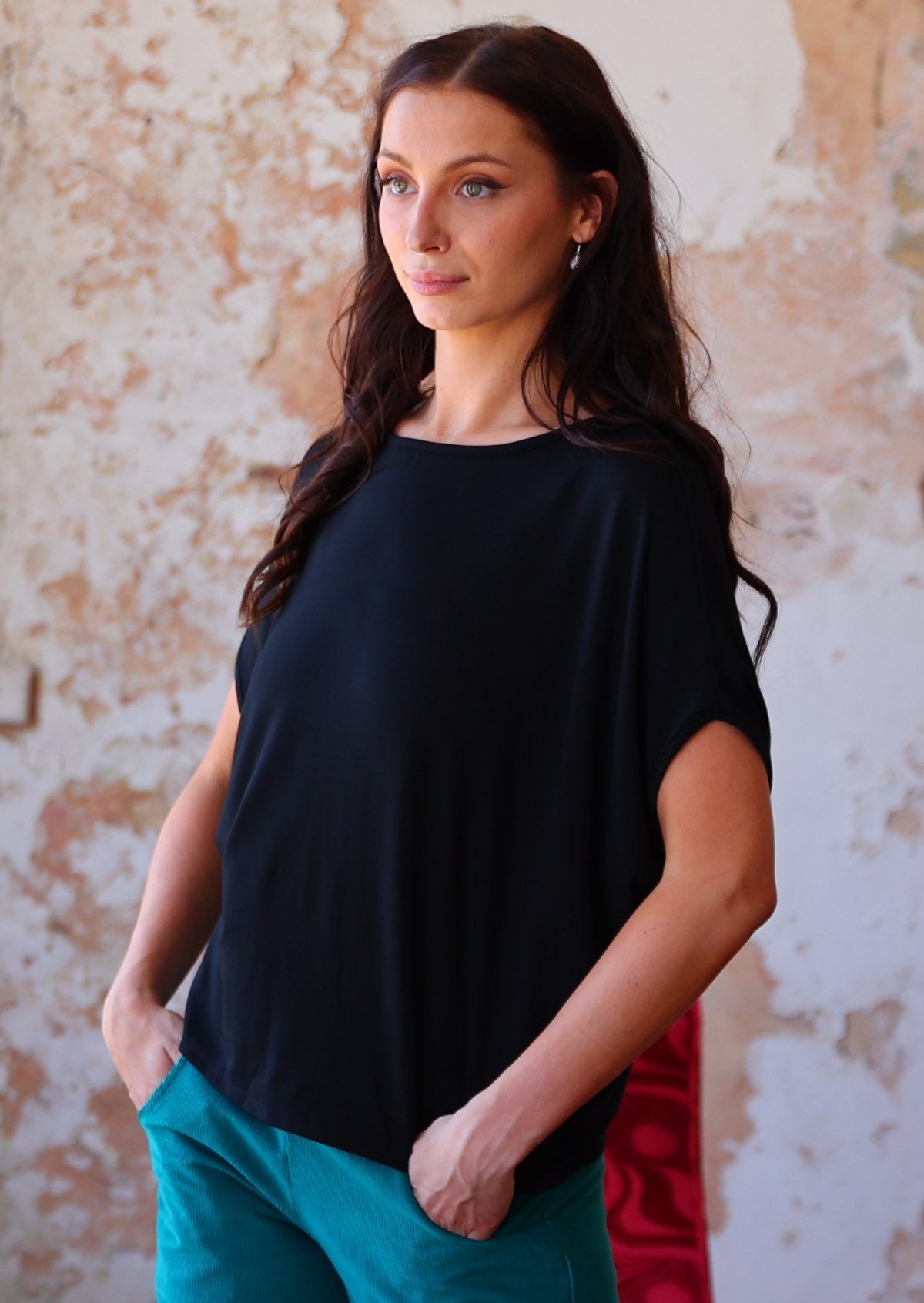 batwing t-shirt black on woman with dark hair