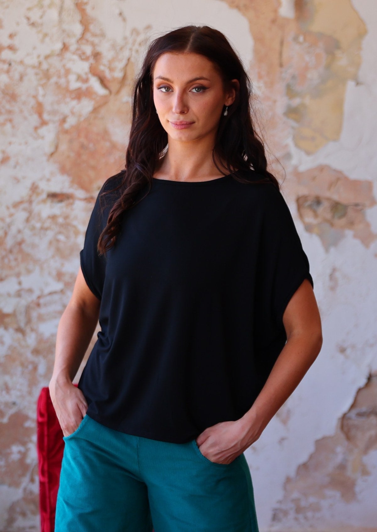 Woman wearing batwing t-shirt black