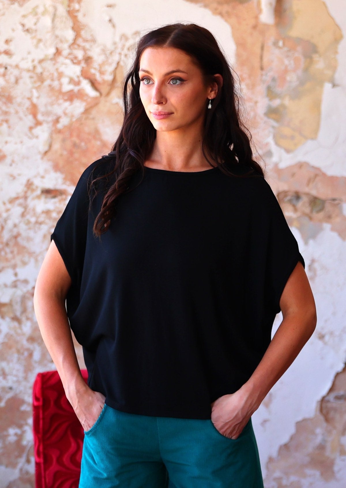 Woman wearing batwing t-shirt black in rayon