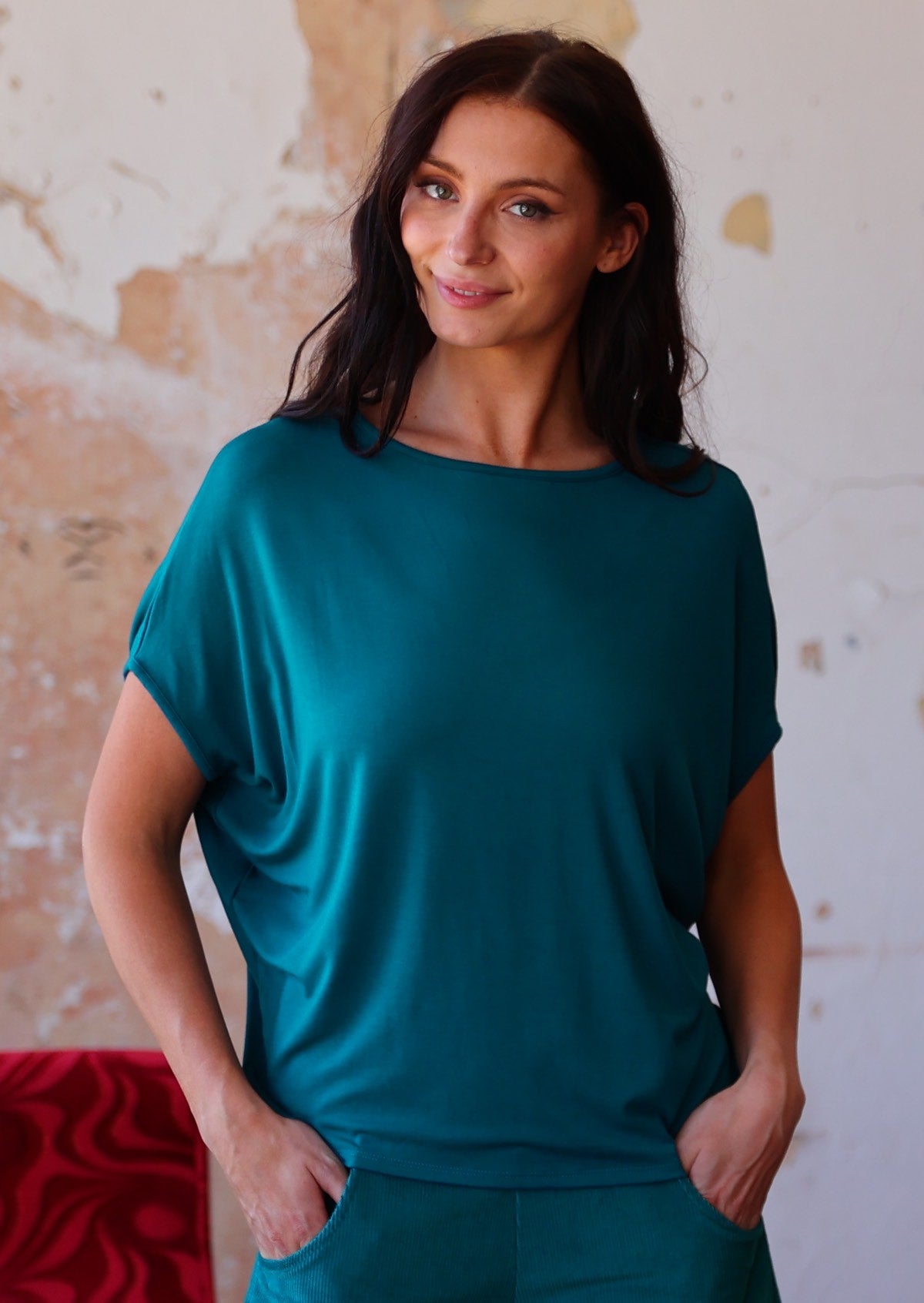 woman in teal blue
rayon batwing t-shirt