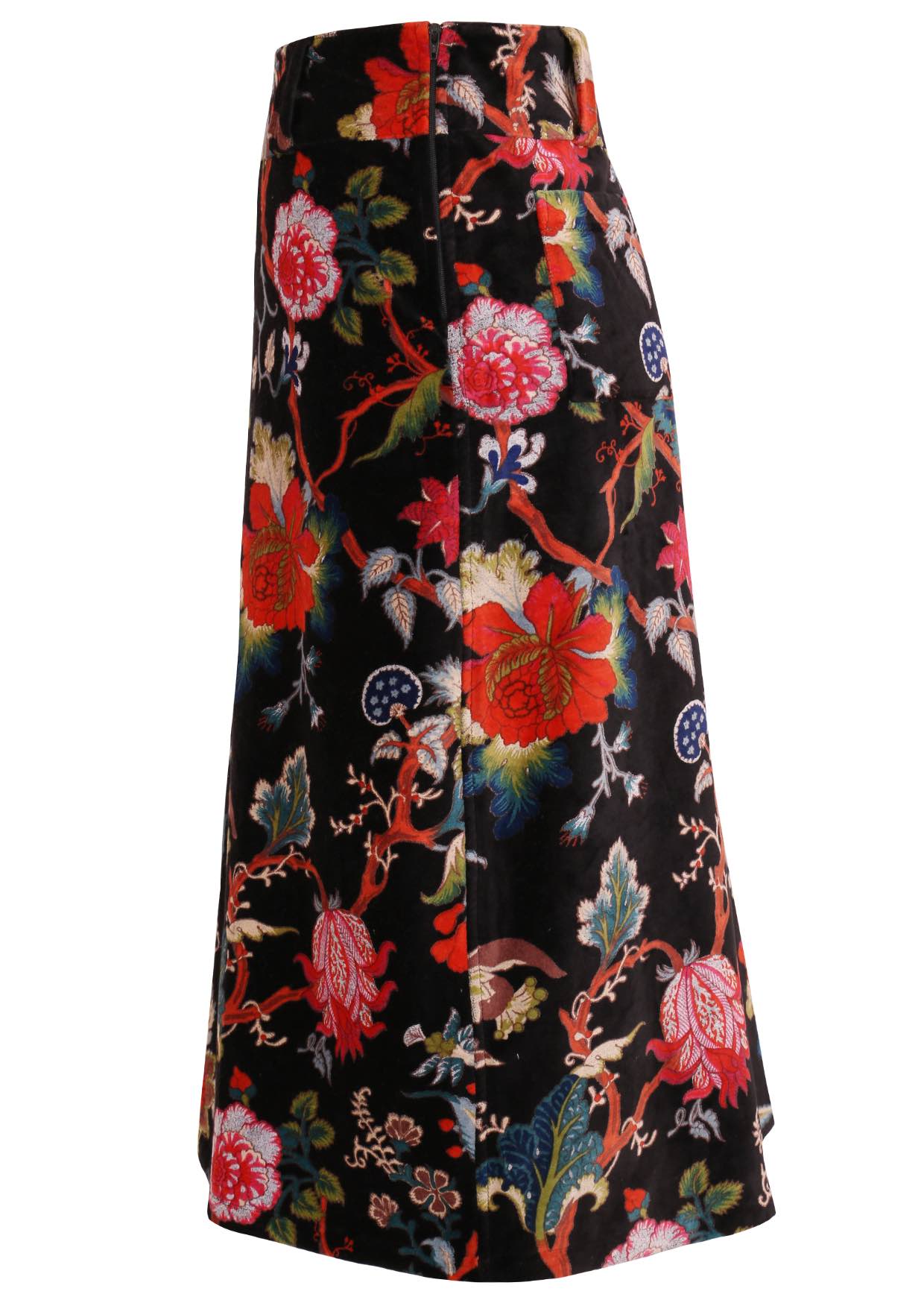 Side view of cotton velvet midi length A-line skirt with side zip, in multi-coloured Jacobean floral print on a black base