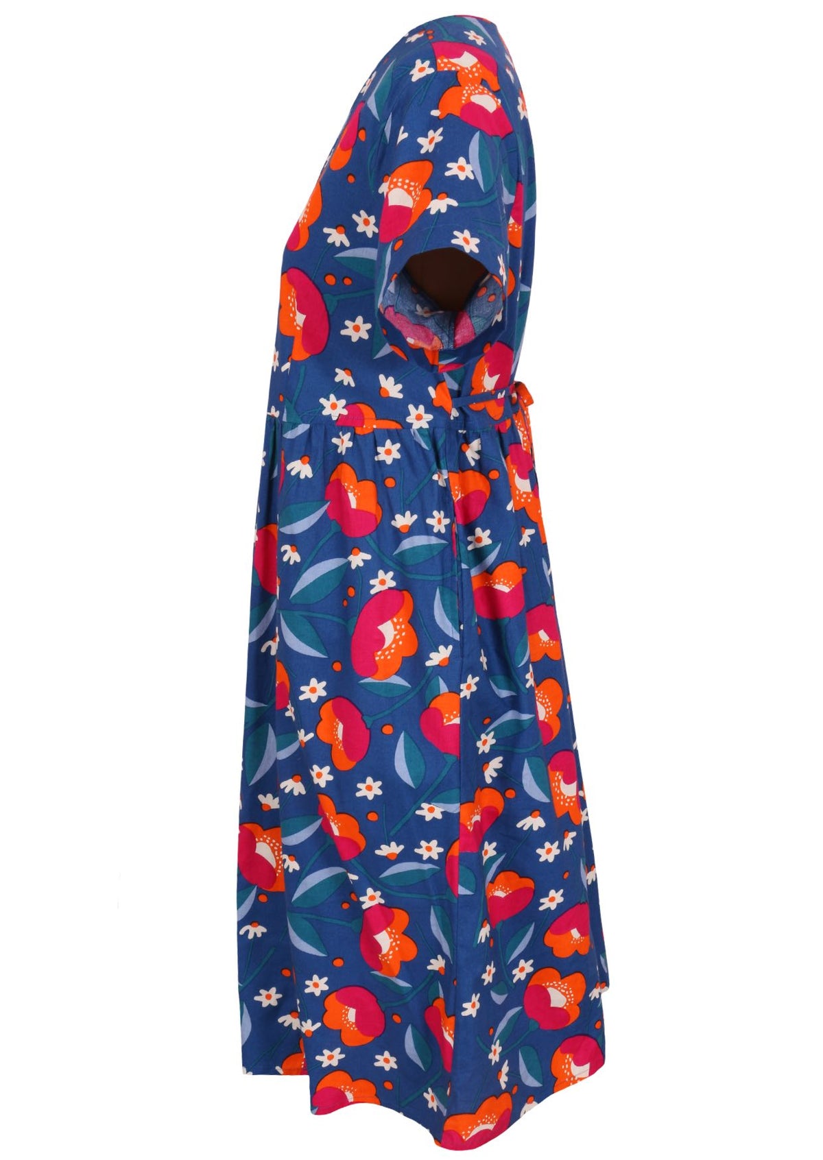 Side view of a royal blue based floral cotton button through dress with short sleeves