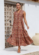 Sleeveless, cotton tiered maxi dress with buttoned bodice, mandarin collar, V neckline and hidden side pockets.