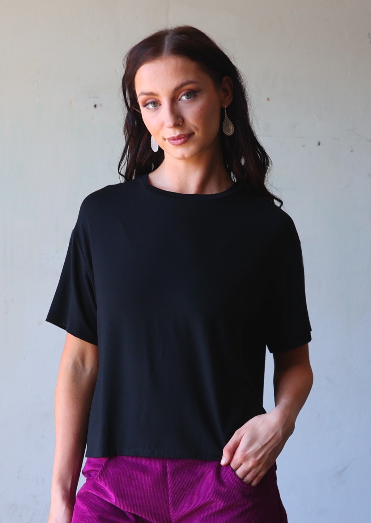 woman in loose fit black t-shirt
