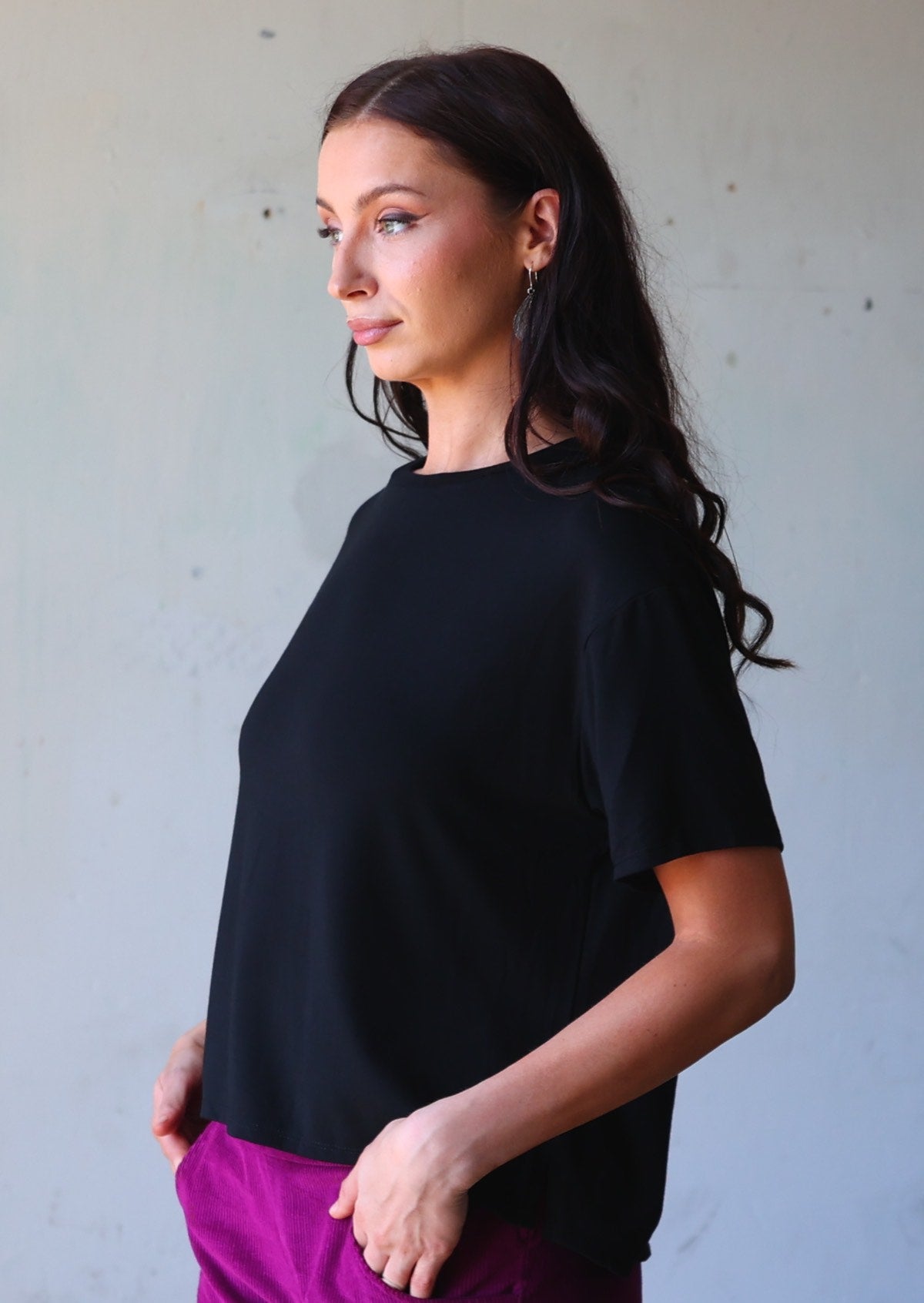 woman in loose fit black t-shirt crew neck