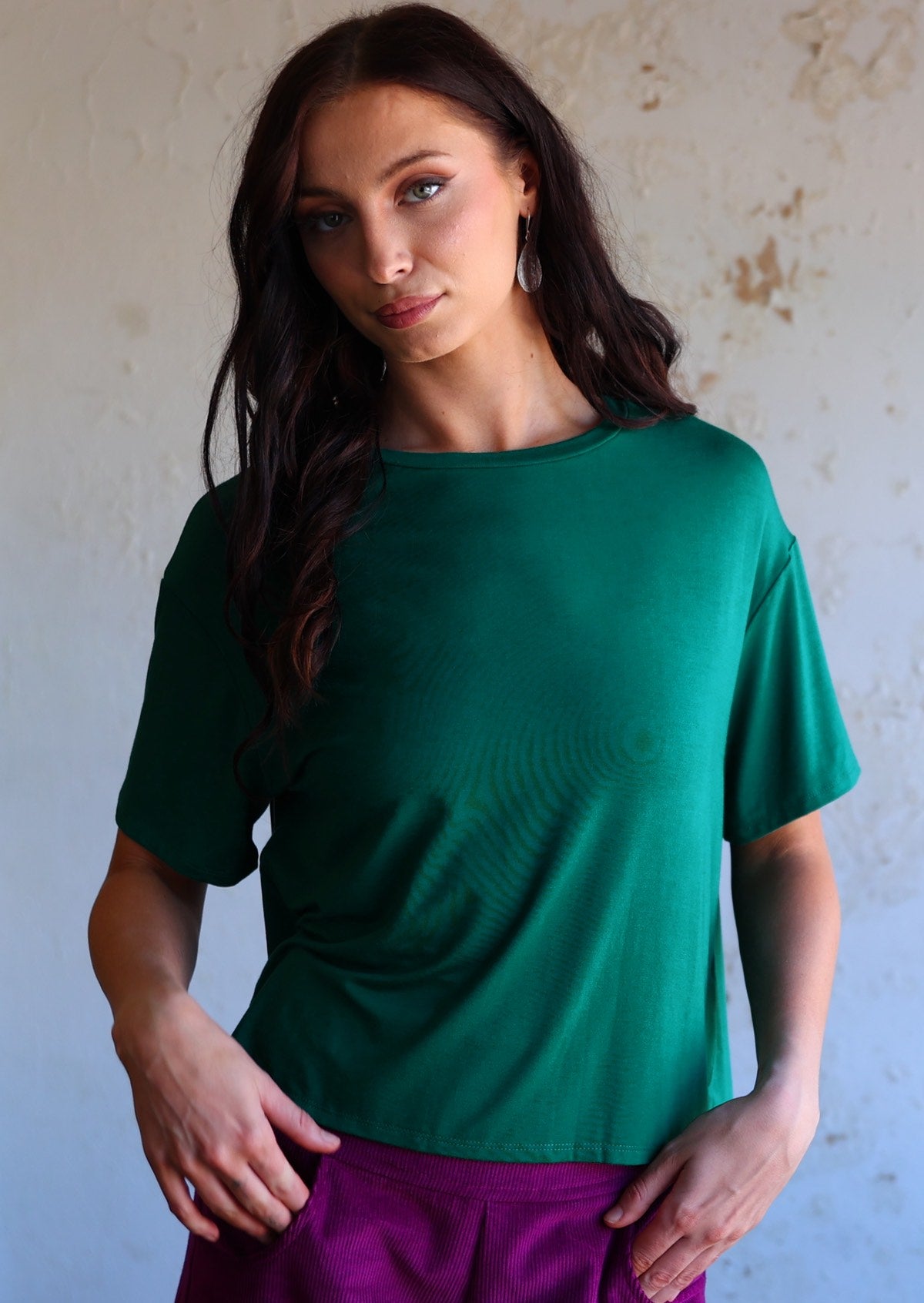 woman in jade green loose fit t-shirt