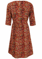Back image of knee length cotton dress with 3/4 sleeves and key hole button closure at the back.