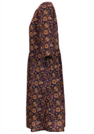 Relaxed fit knee length cotton dress with pockets in Indian floral print on dark purple base.
