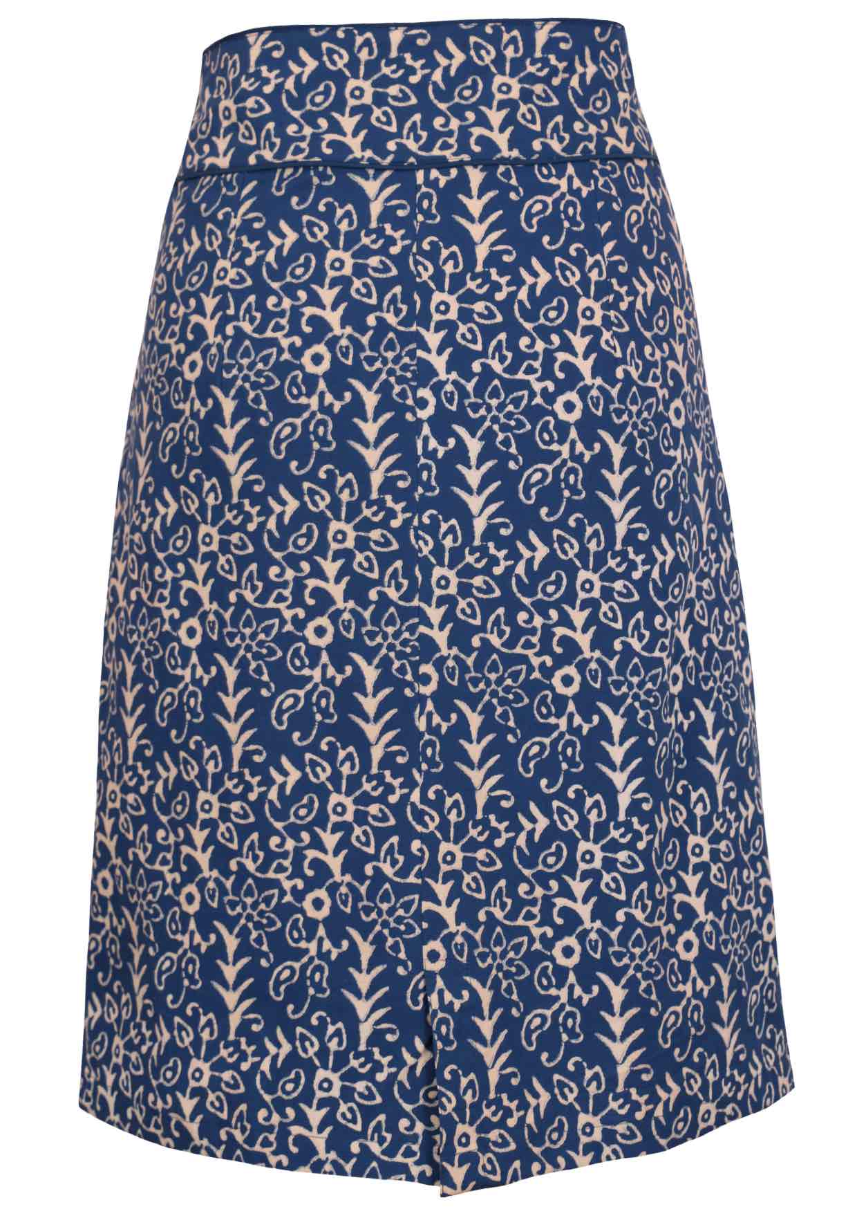 Back mannequin photo on cotton pencil skirt in floral on blue base with contrasting piped detail around the waistband and small split at middle bottom hem