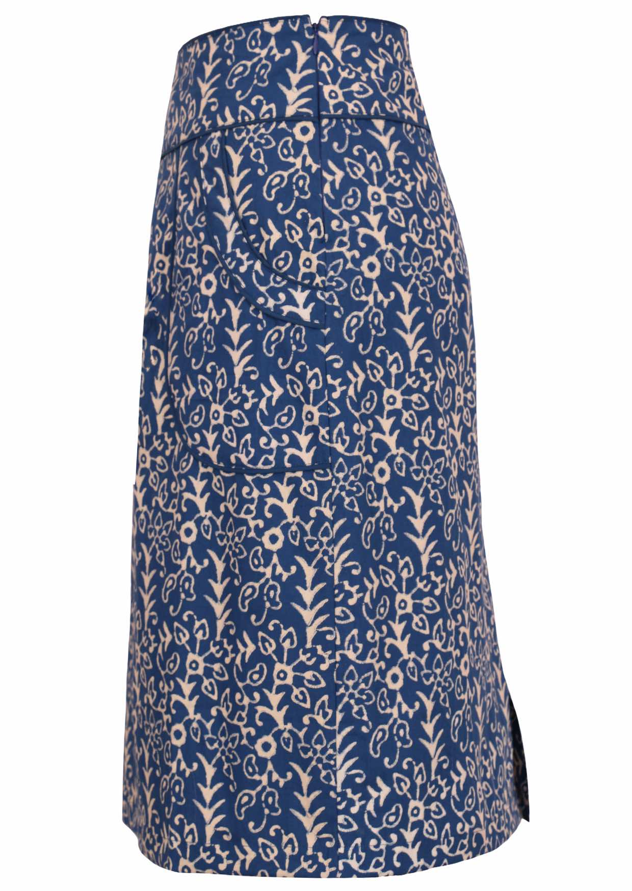 Side mannequin photo on cotton pencil skirt in floral on blue base with contrasting piped detail around the waistband and pockets, with side zip