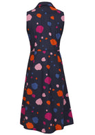 Sleeveless dress with colorful polka dot pattern on navy blue base.