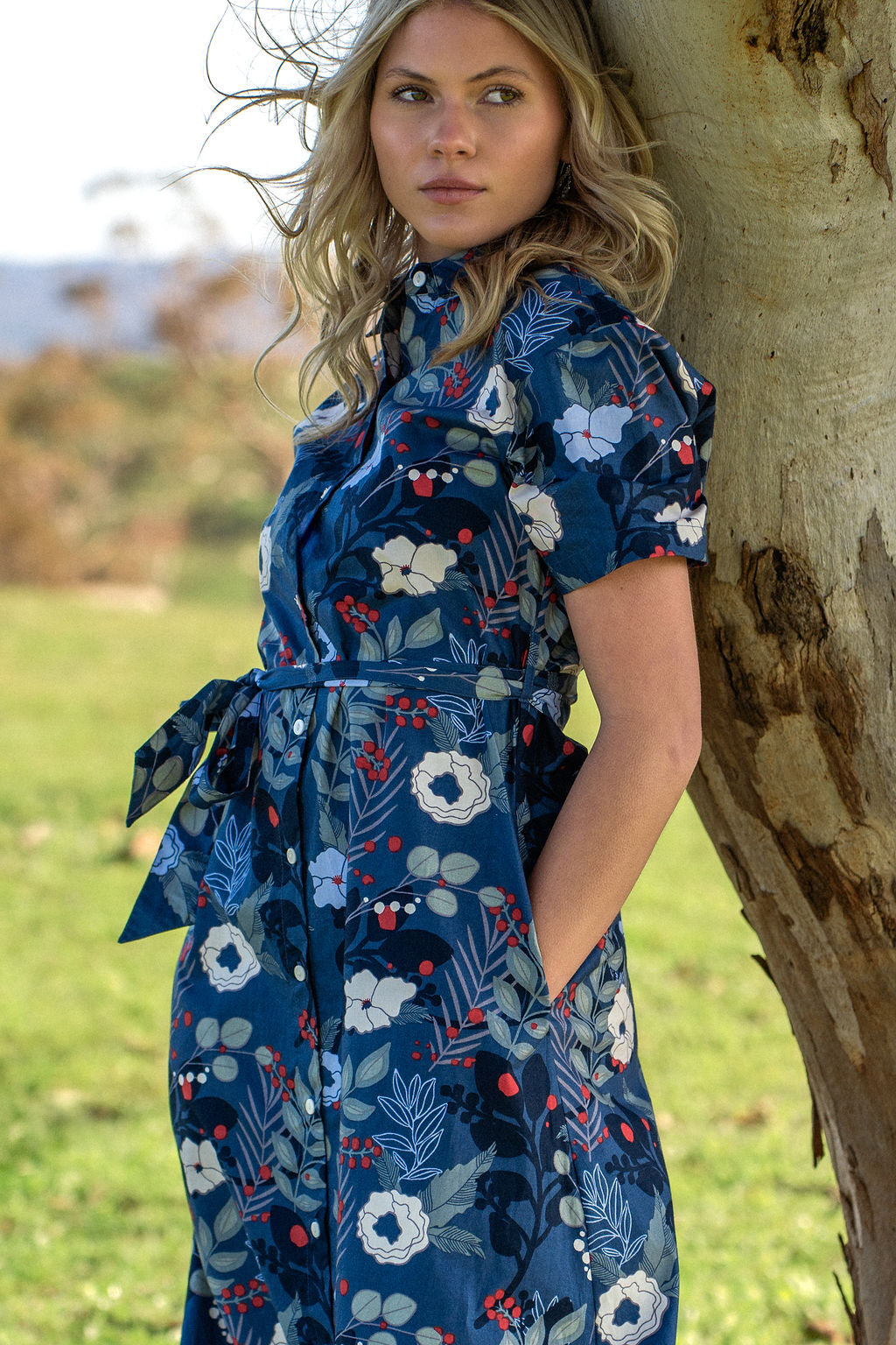 Model with hand in pocket wearing floral print Chelsea dress 100 percent cotton