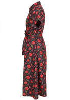 Side image of button through cotton dress with collar and tieable waistband.