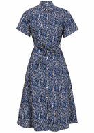 Front mannequin photo of button through shirt dress with collar, short sleeves and wide fabric waist tie