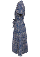 Side mannequin photo of button through shirt dress with collar, short sleeves and wide fabric waist tie