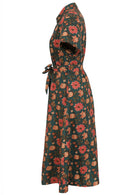Beautiful 1950's inspired cotton dress in beautiful floral print on deep green base with pockets and waist tie.