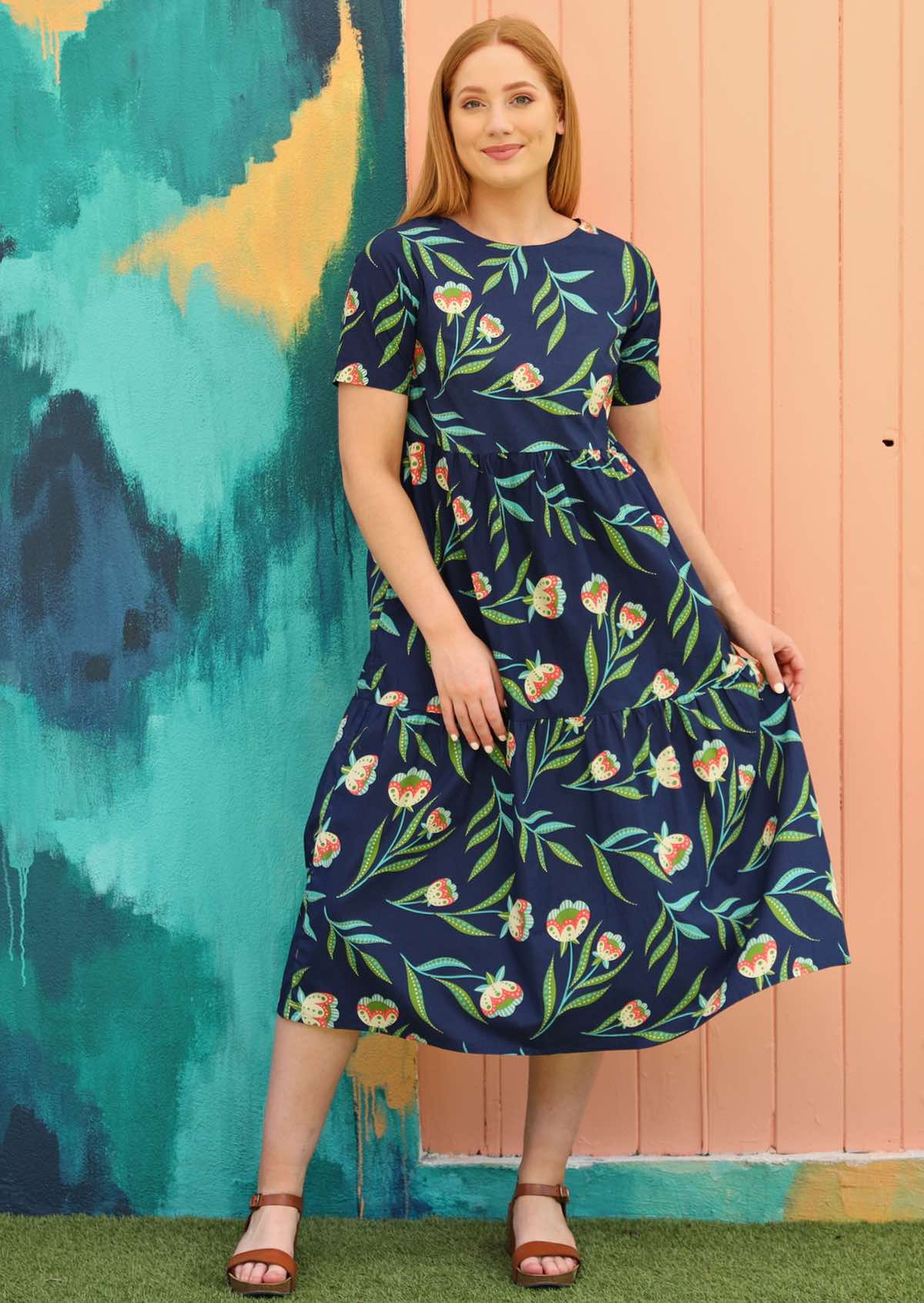 Model wears relaxed fit cotton floral dress with