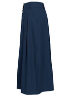 Side view of ankle length cotton skirt in dark blue with belt loops, pockets and box pleats in front and back