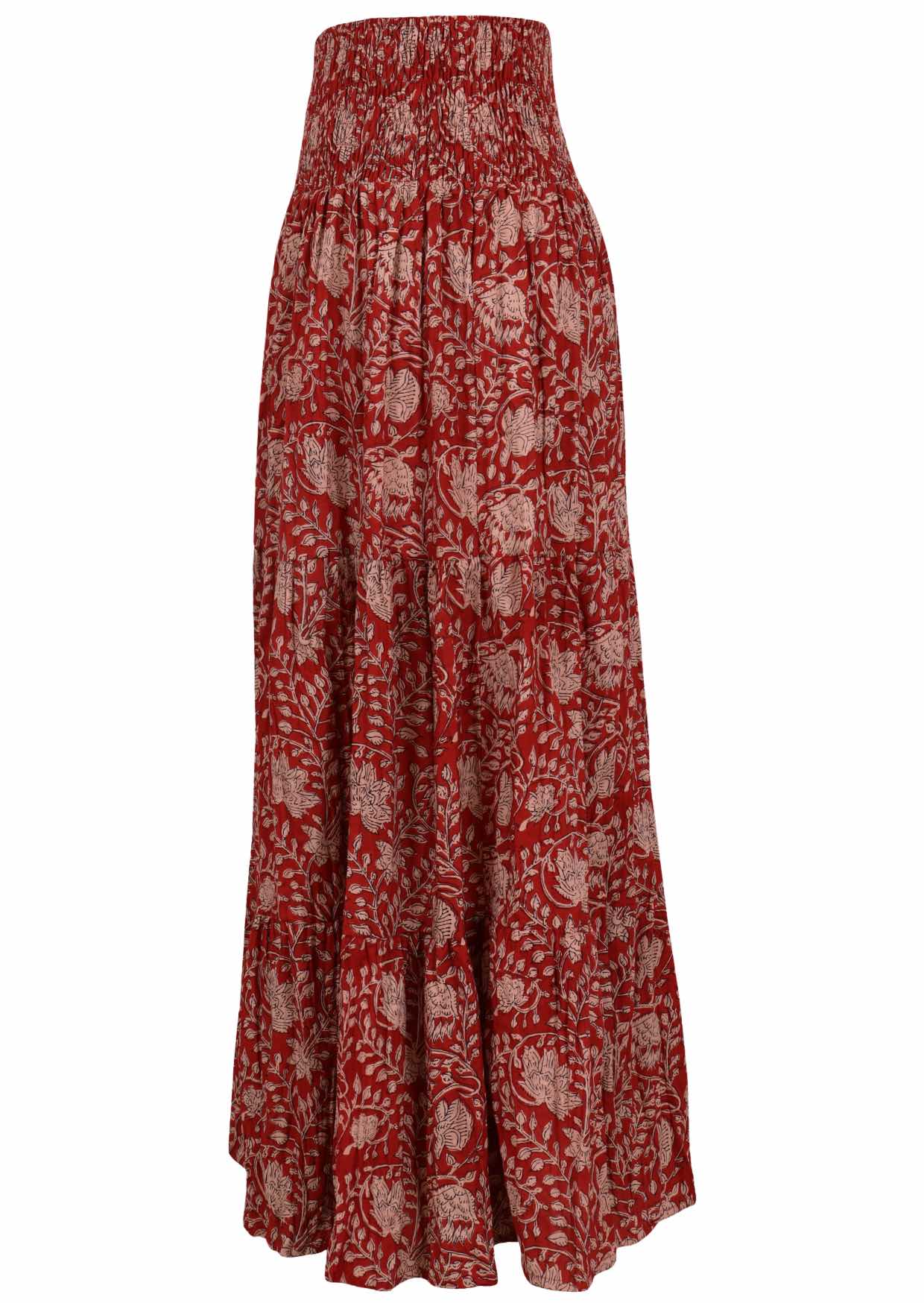 Side view of patterned cotton skirt on a red base floral print with elasticised waistband.