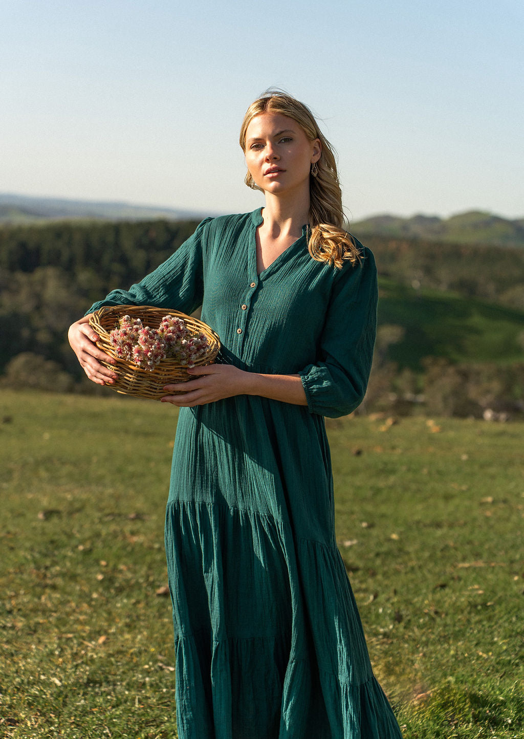 Woman on hillside wearing teal cotton maxi dress
