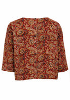 Back view of cotton relaxed fit 3/4 sleeve top with decorative buttons at the back.