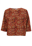 100% cotton relaxed fit top with 3/4 sleeves and earthy floral print on warm red base.
