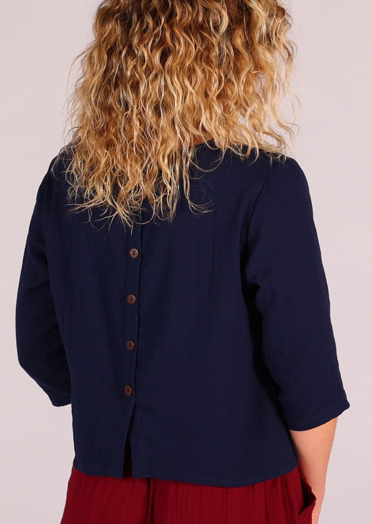 Double cotton top in dark blue with decorative buttons centre back
