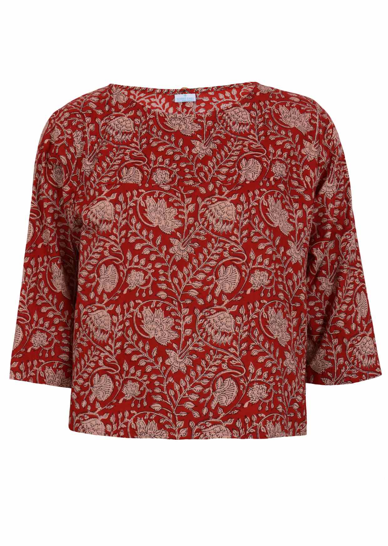 Front view of red based floral top with round neckline and 3/4 sleeves