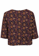 Loose fit cotton top with 3/4 sleeves and decorative buttons down at the center of the back.