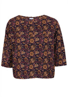 100% cotton 3/4 sleeve boxy top in dark purple based floral print.