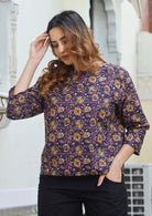 Lightweight 100% cotton top in dark purple with wide round neckline and 3/4 sleeves.