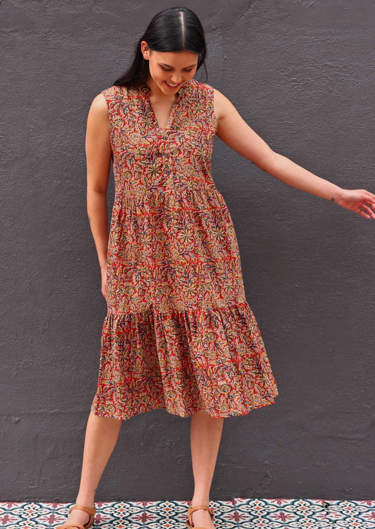 Model standing wearing Wild Spice print midi length sleeveless Indian cotton sundress