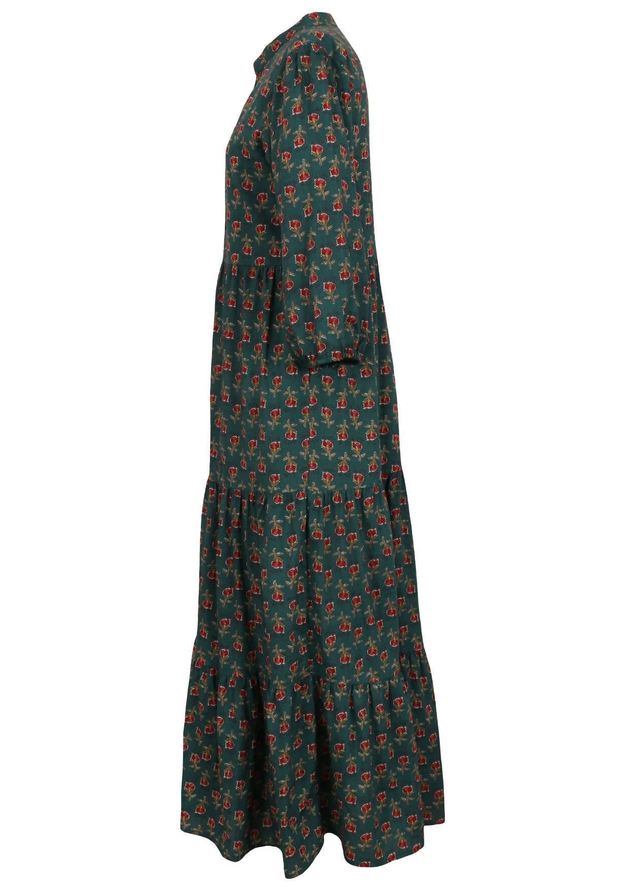 Side view of a full length maxi dress with 3 tiered flowy skirt, mandarin collar, buttoned bodice and pockets