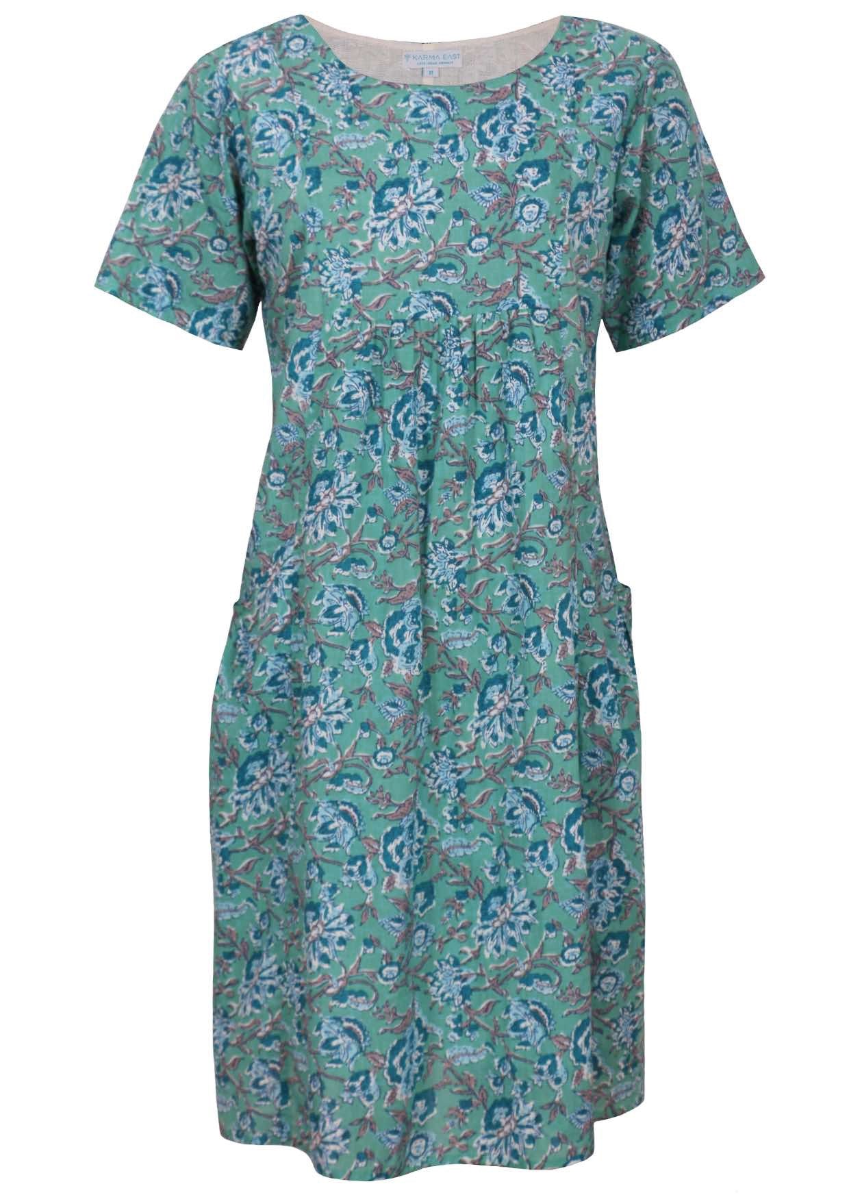 100% cotton loose dress with short sleeves, pockets and gathers under the bust.