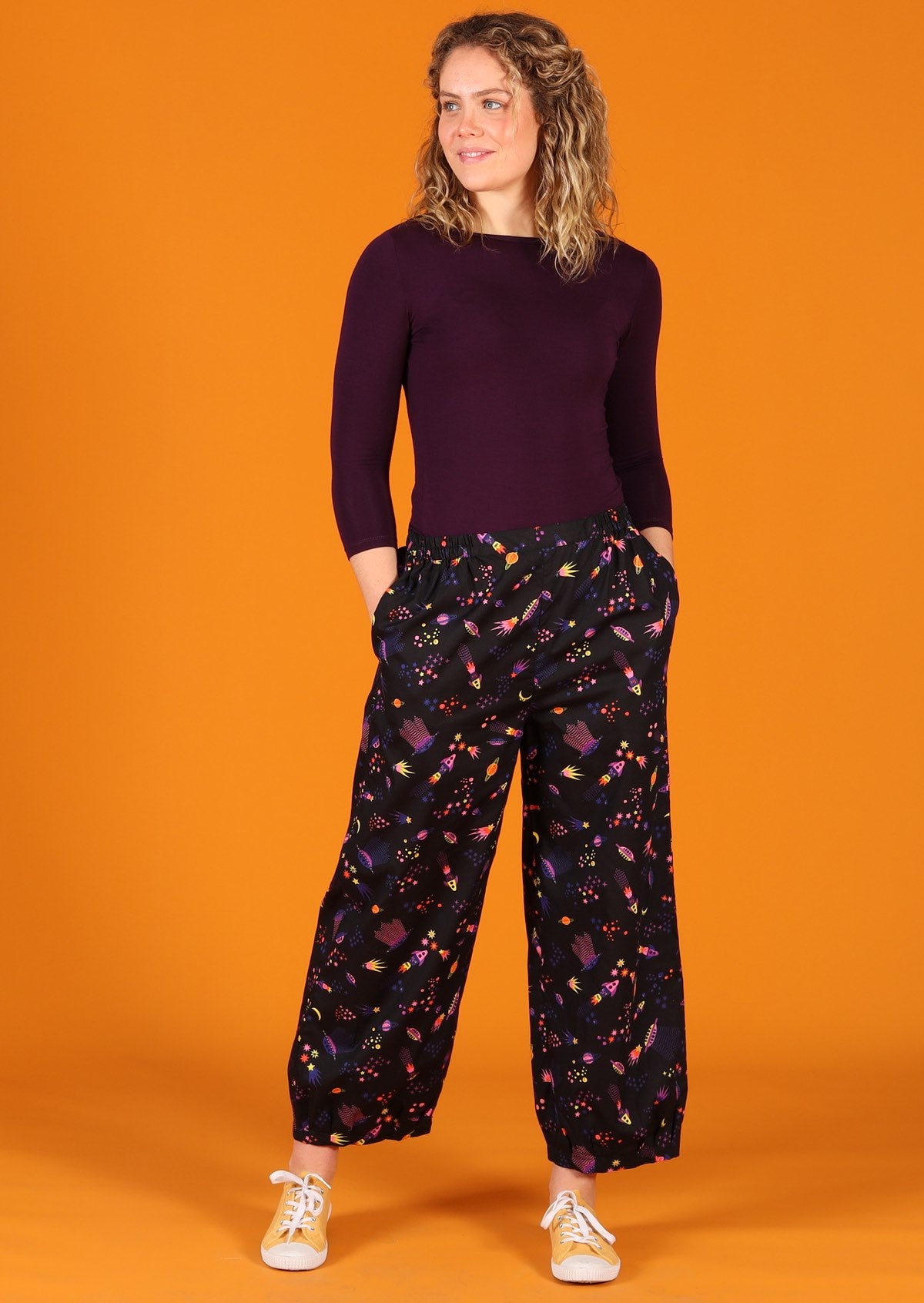 Greta Pants Astro 100% cotton colourful space themed print on black base loose fit pants with tapered ankles and pockets | Karma East Australia