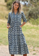 woman with hill in background wearing block print cotton maxi dress in Indigo