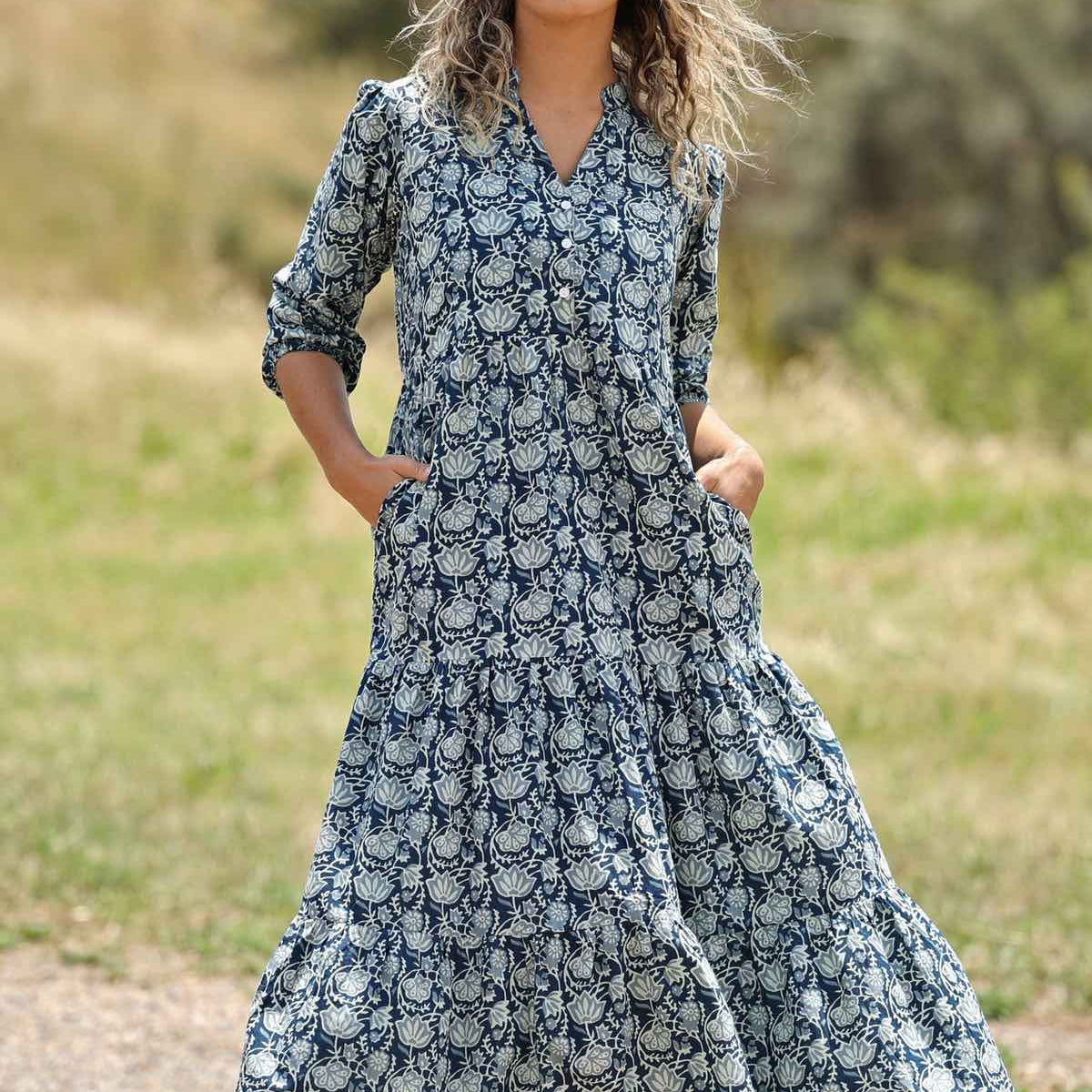 woman with hill in background wearing block print cotton maxi dress in Indigo print