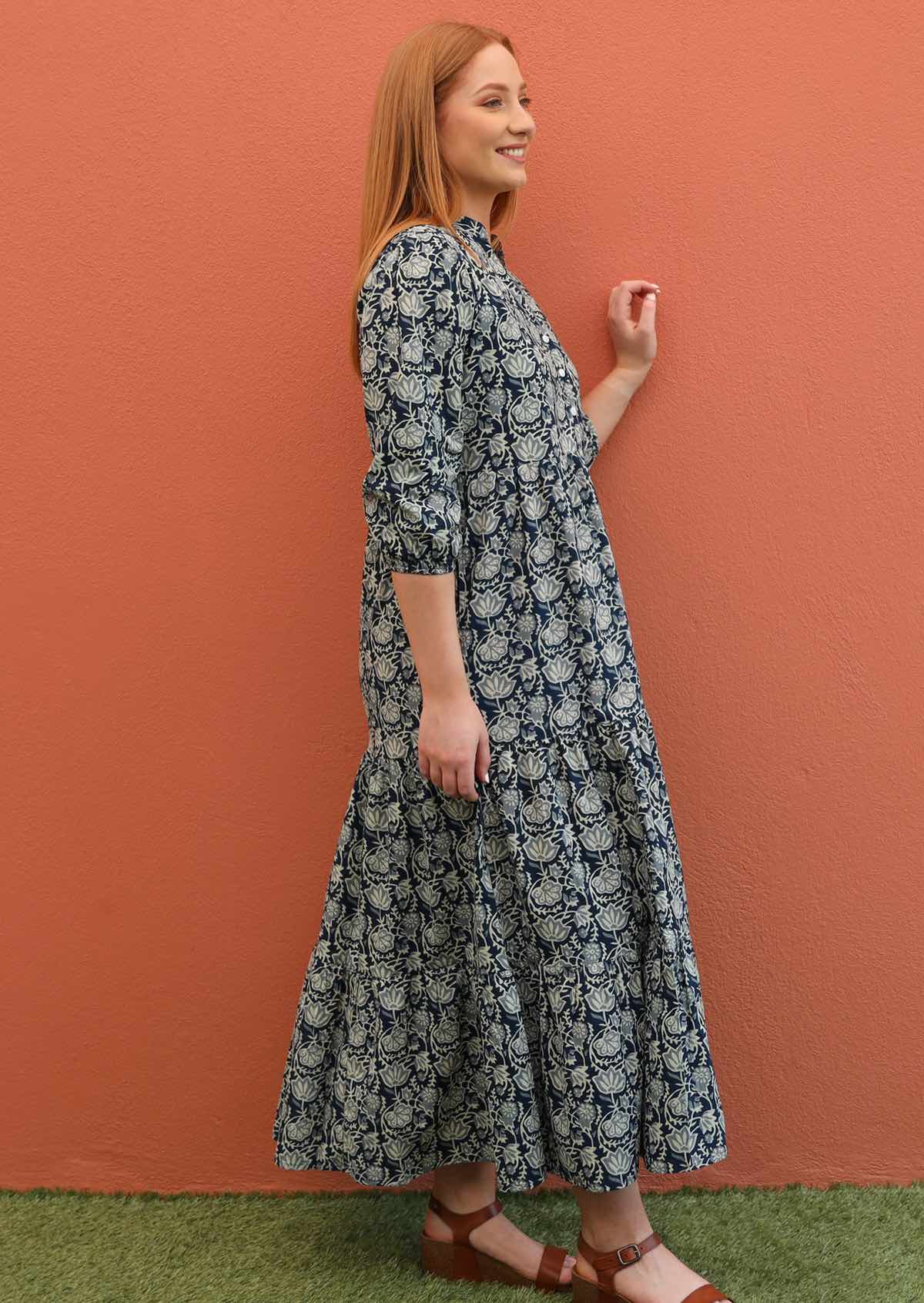 Model shows the side profile of her 100% cotton maxi dress.