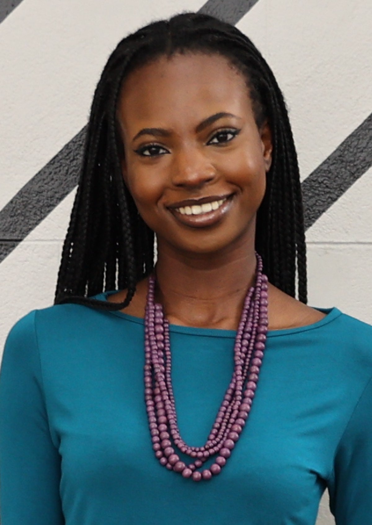 Four strands of different sized wooden beads