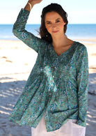 Floral printed button through cotton top with long sleeves and V neckline.