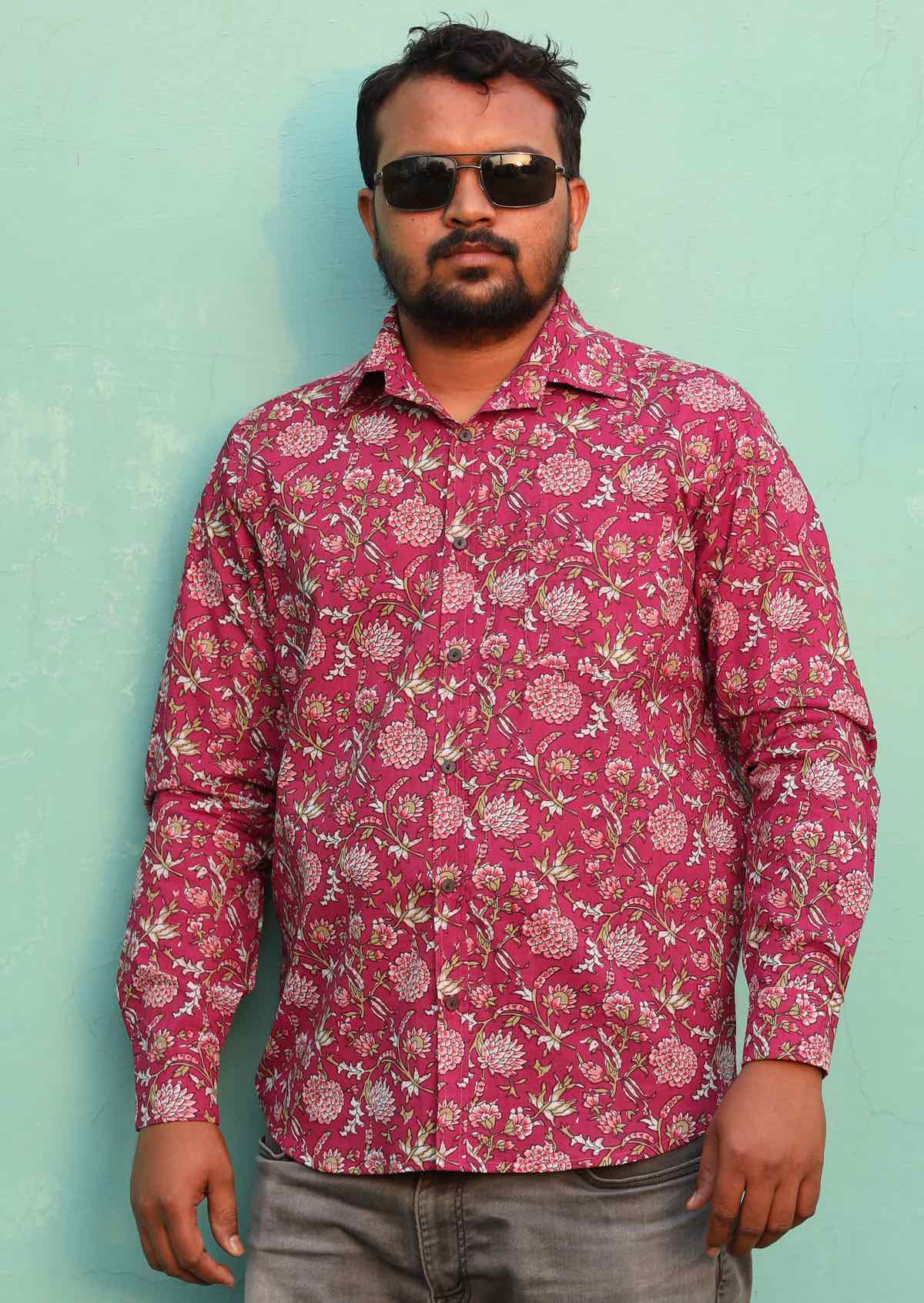 Man wears cotton long sleeve Indian floral print on a cranberry colour base shirt