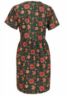 Back image of relaxed fit short cotton dress in deep green with button closure back.