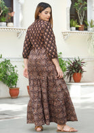 A two-print maxi dress featuring a contrasting printed bodice paired with a flowing maxi skirt in a different complementary pattern.