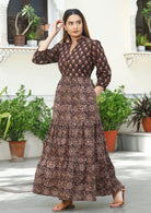 Model in 100% cotton three tiered maxi dress with buttons, pockets and mandarin collar.