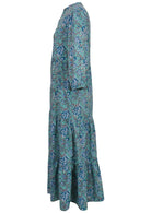 Side view of floral printed cotton maxi dress with 3/4 sleeves and pockets.