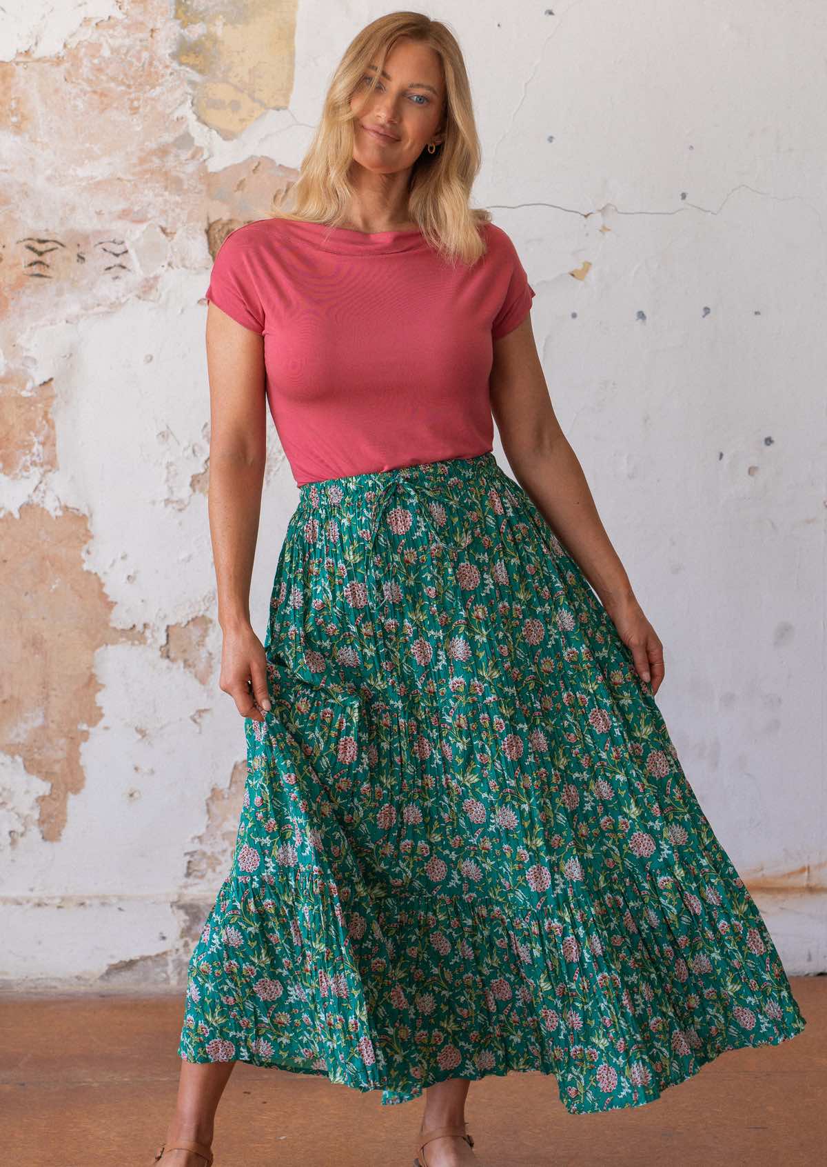 Model wearing 100 percent cotton maxi skirt with elastic waist and drawstring